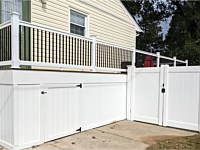 <b>White Vinyl Fencing creates under deck storage with a gate to access below the deck</b>